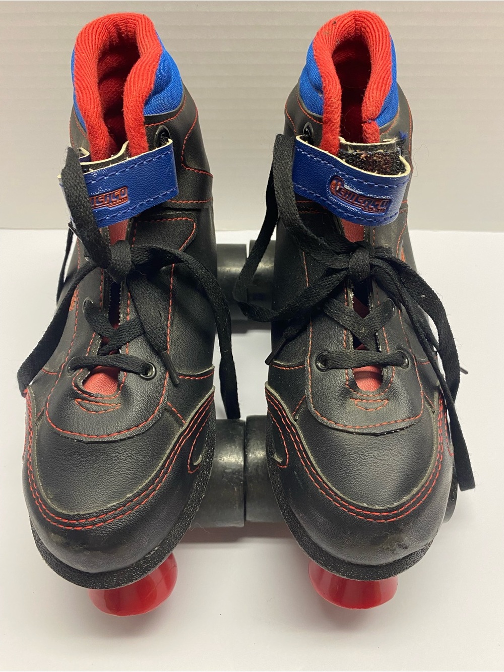 Youth Black Roller Skates with Red and Blue Accents - Adjustable Fit